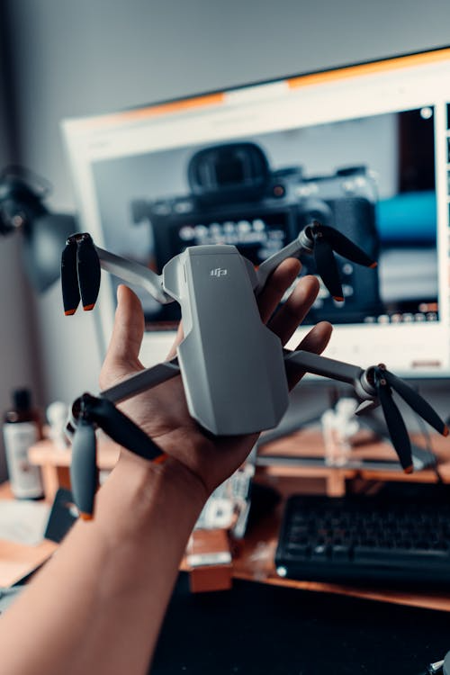 From Scattered Data To Sky-High Authority: Mastering The Drone Pilot’s Archive 2 Photo by Çağın KARGI: https://www.pexels.com/photo/man-holding-a-drone-on-the-background-of-a-computer-7934724/